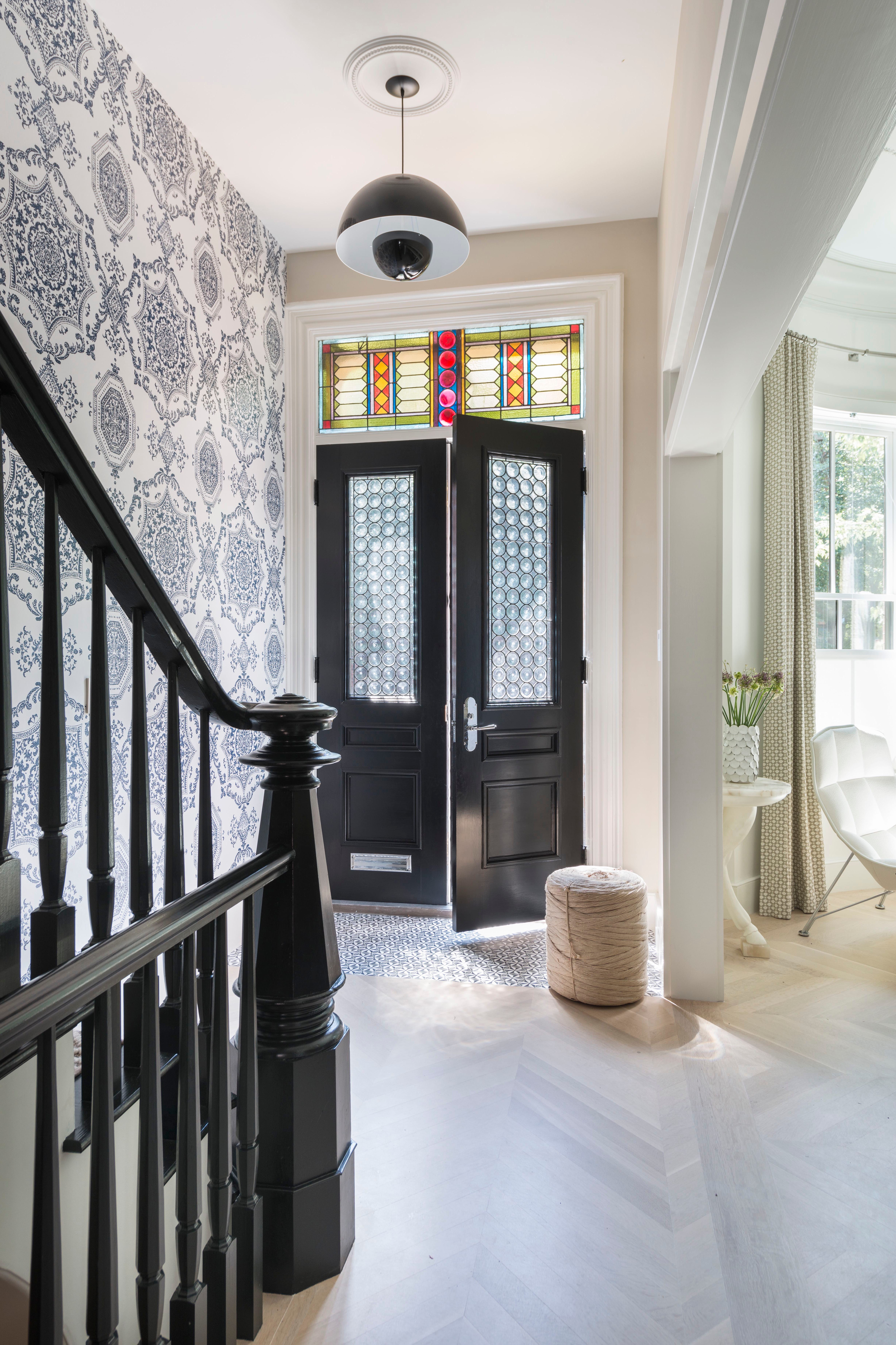 Dramatic entryway wallpaper installation