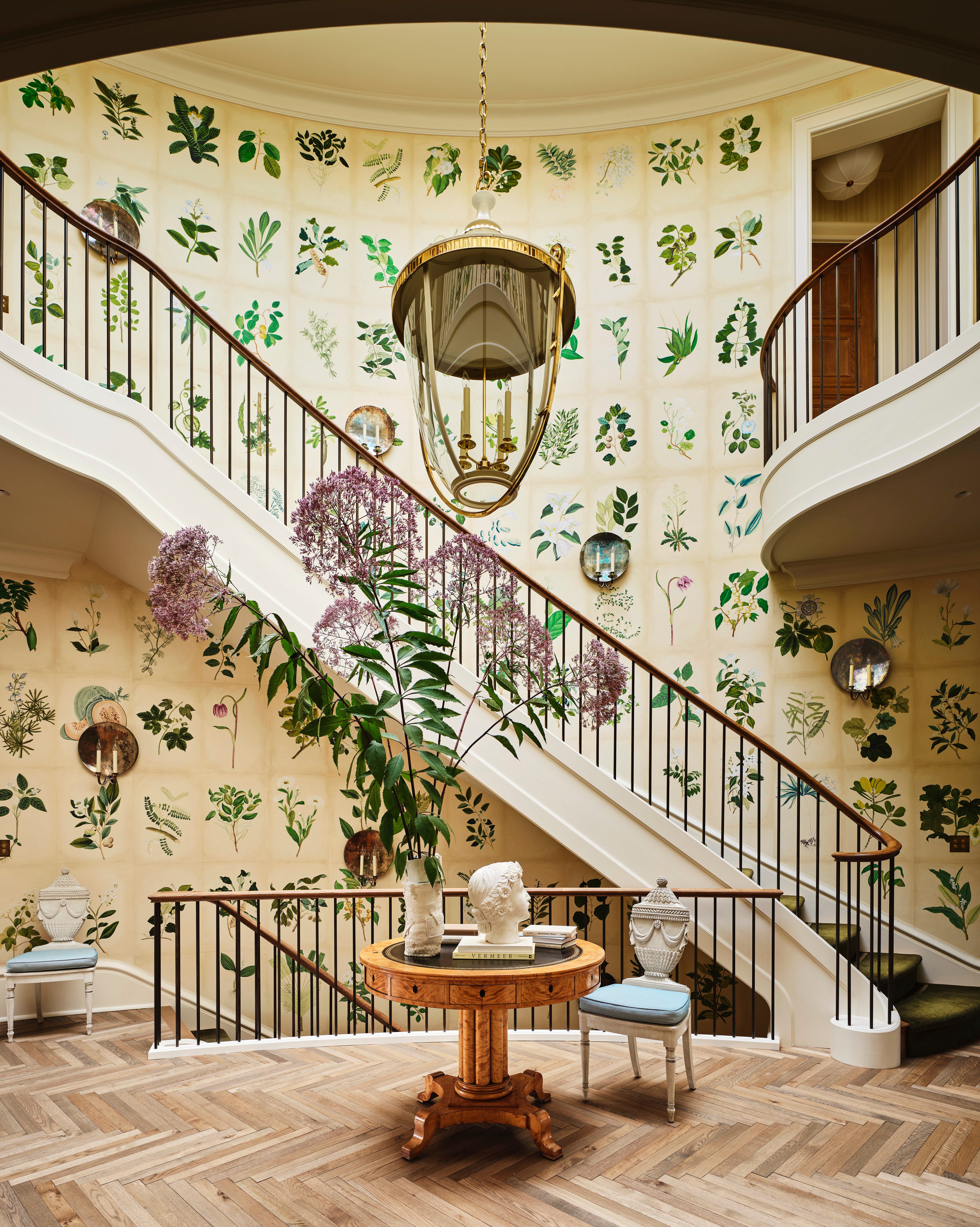 Professional wallpaper installation on high ceiling stairwell in Los Angeles estate