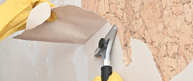 Professional wallpaper removal service in progress